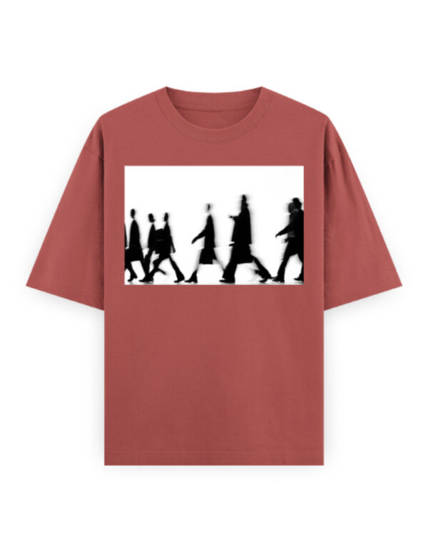 Black oversized t-shirt with grayscale silhouette motion graphic worn by female model – minimalist streetwear style